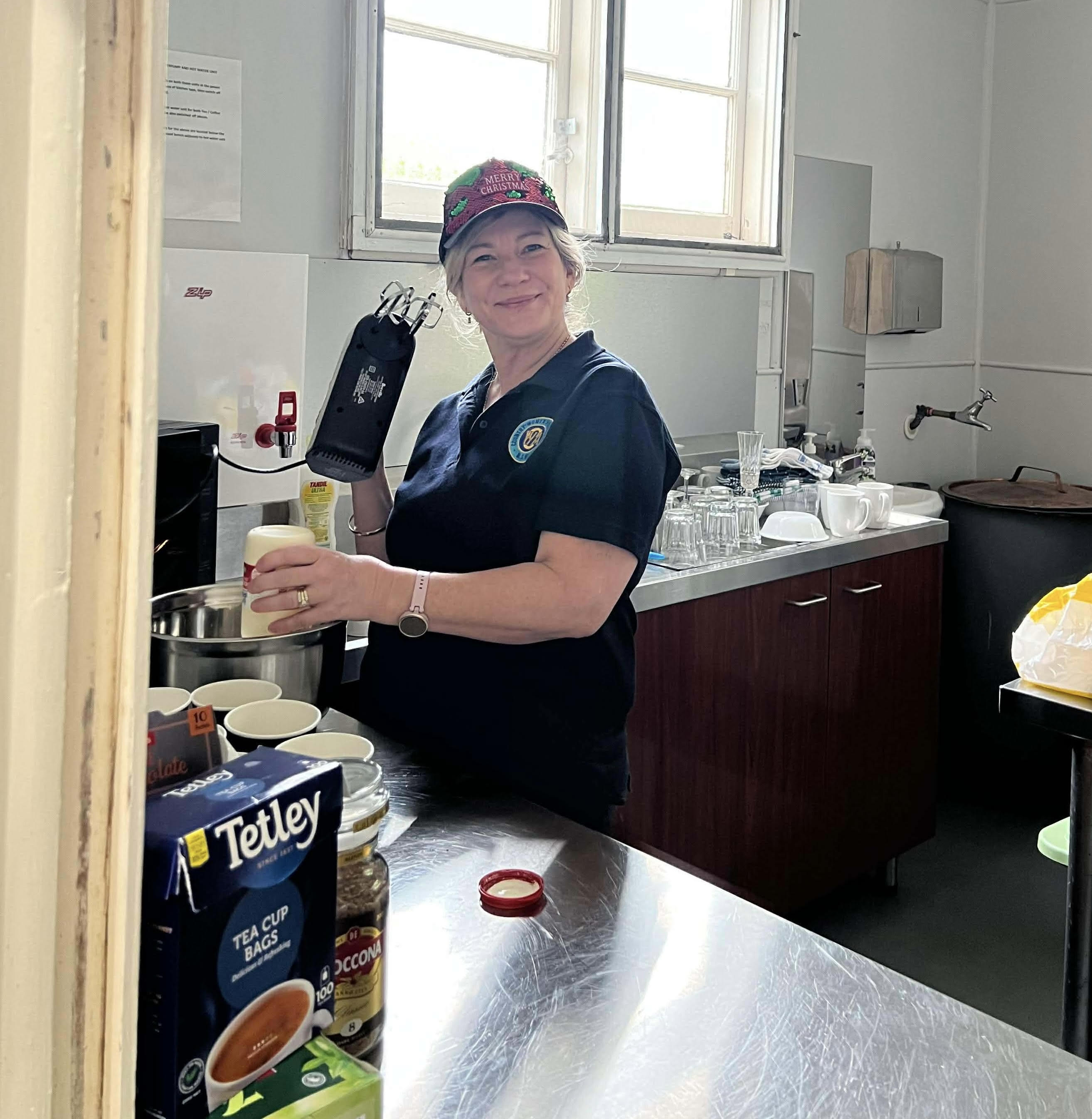 Branch member Julianne whipping up cream for some scones